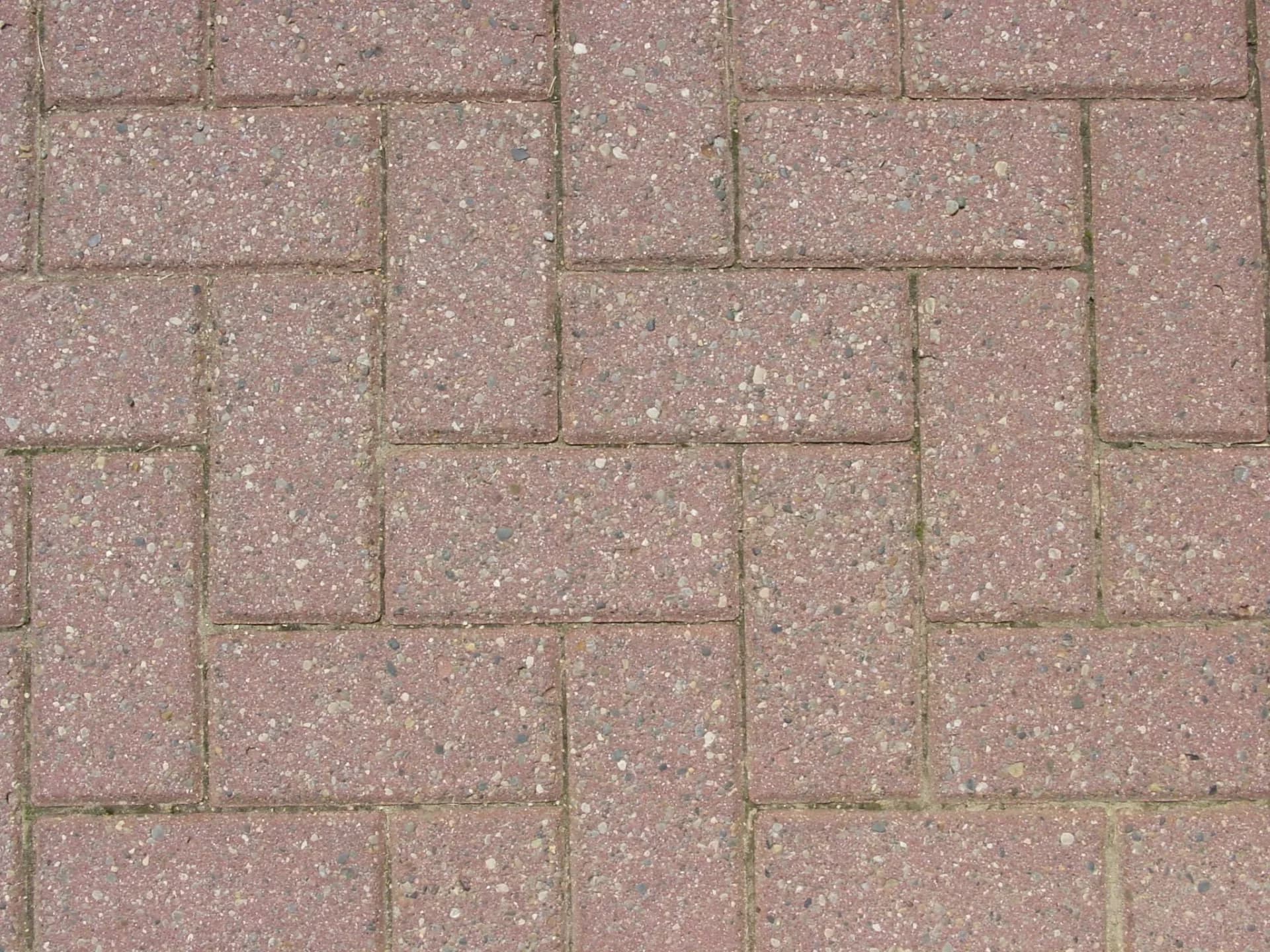 Amber pebble exposed aggregate pool deck with saw-cut joints in Westfield
